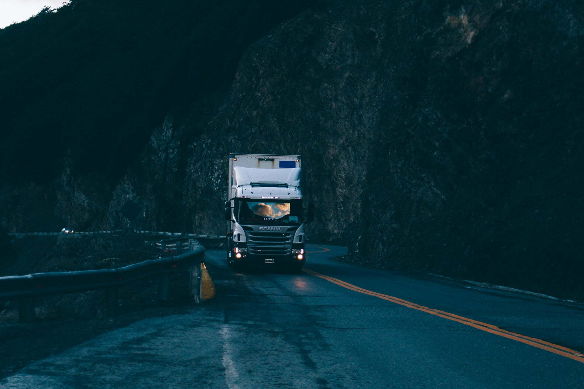 a truck driving on a road