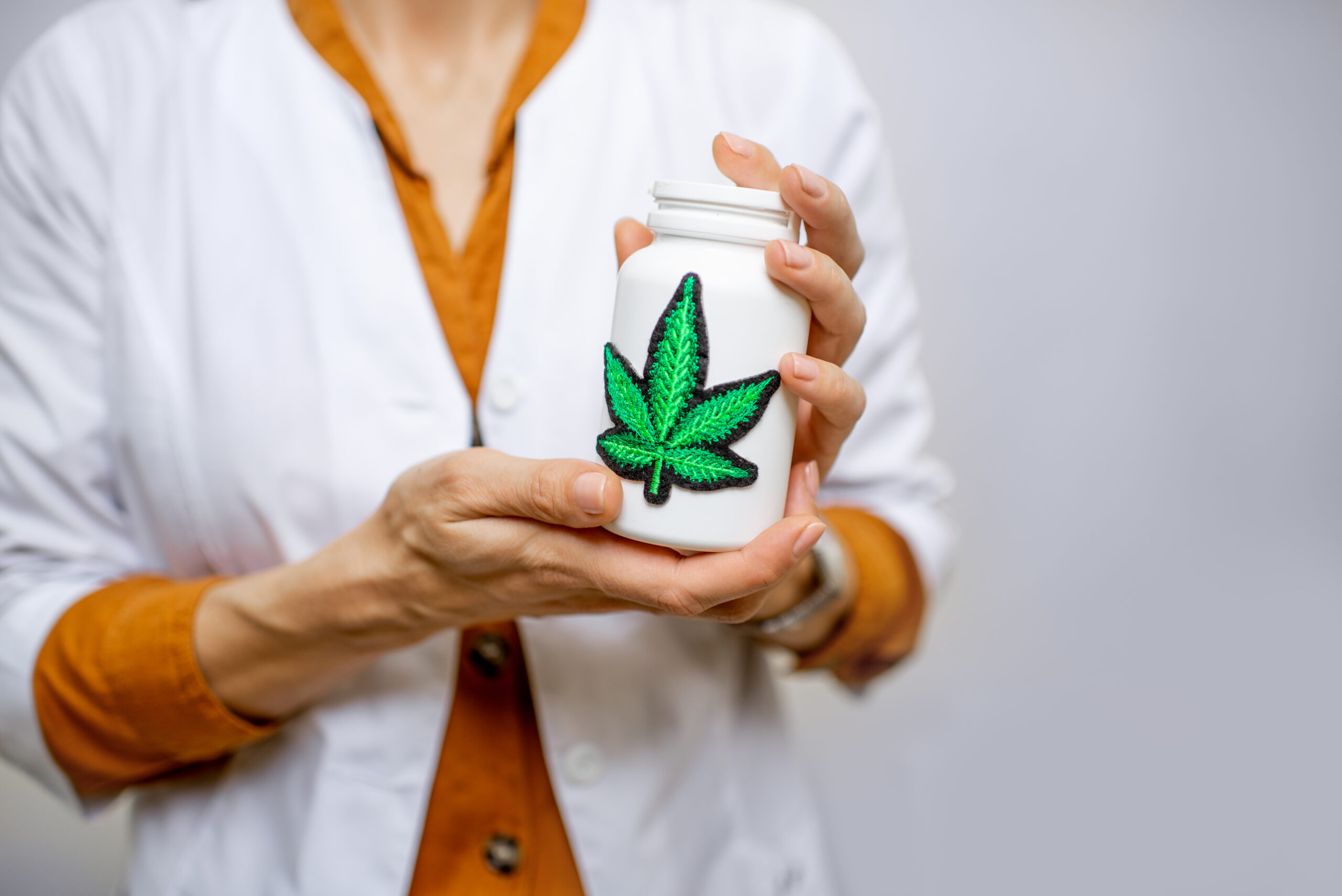 Medical marijuana medication bottle and cannabis leaf symbol