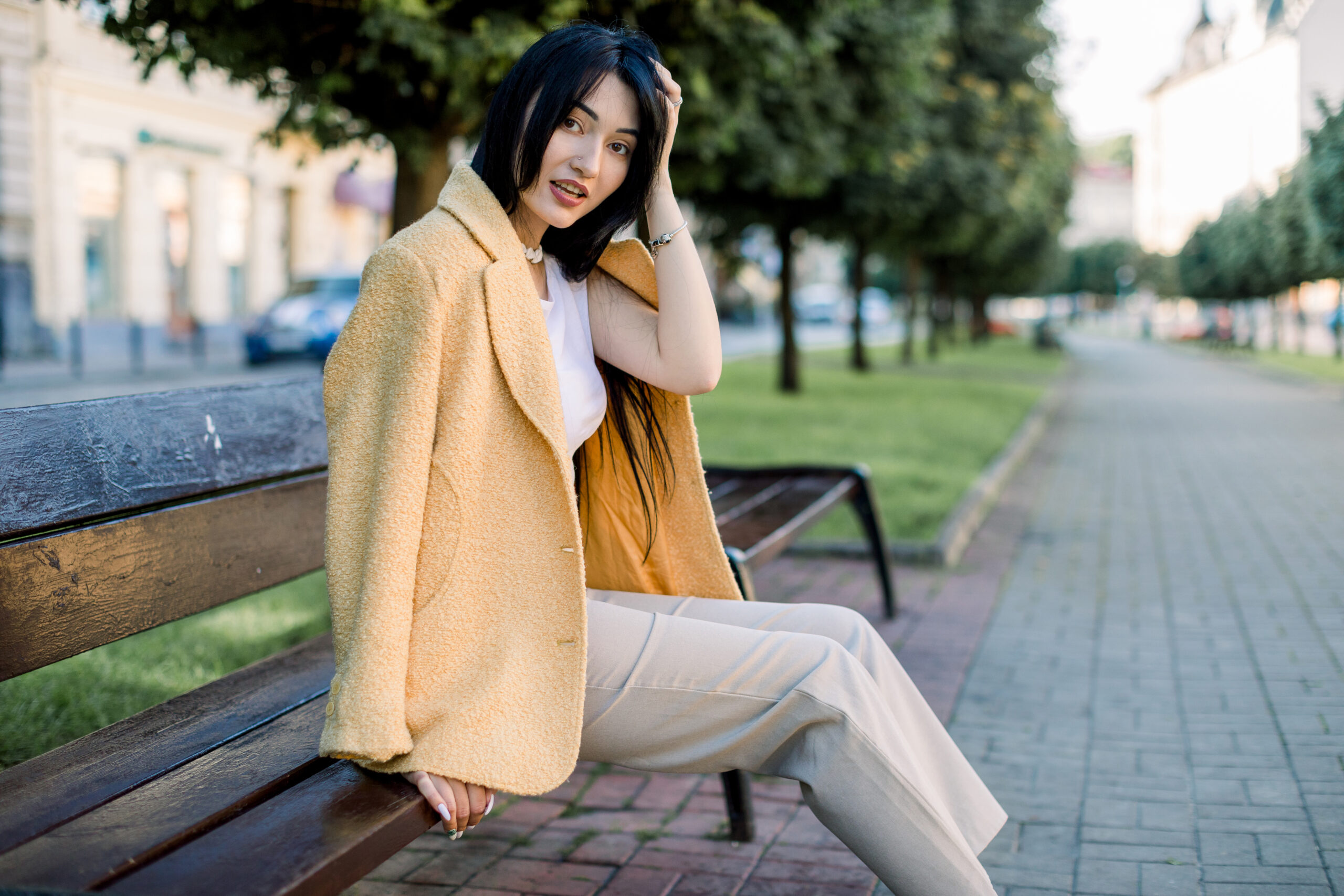 Young Asian woman in modern fashion, illustrating personal style trends.