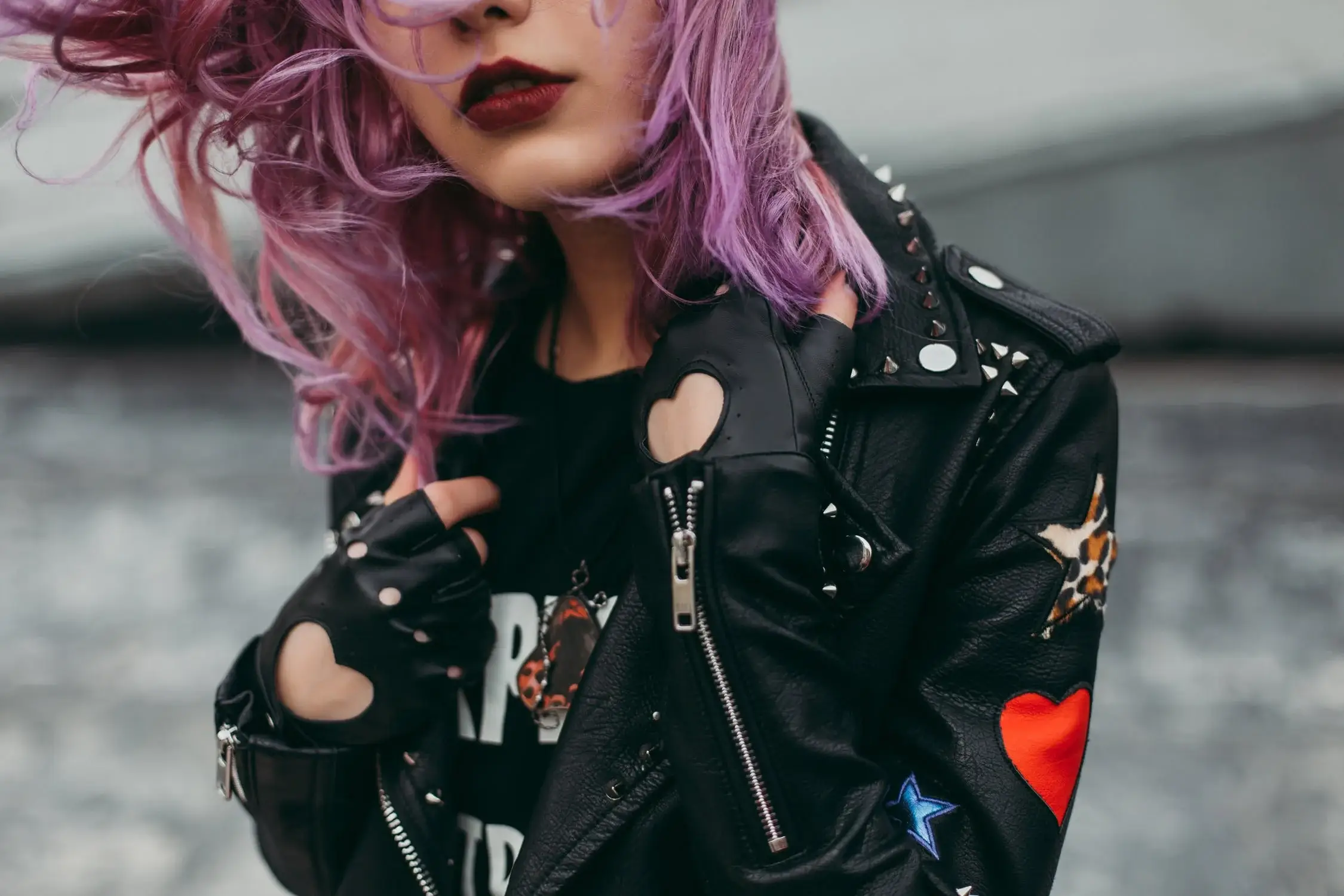 Stylish woman in leather jacket and gloves, personal style fashion statement