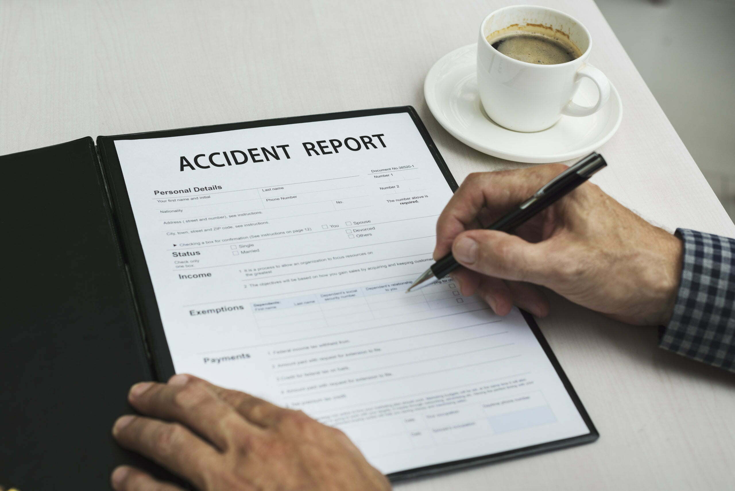 Accident report form and pen illustrating personal injury claims